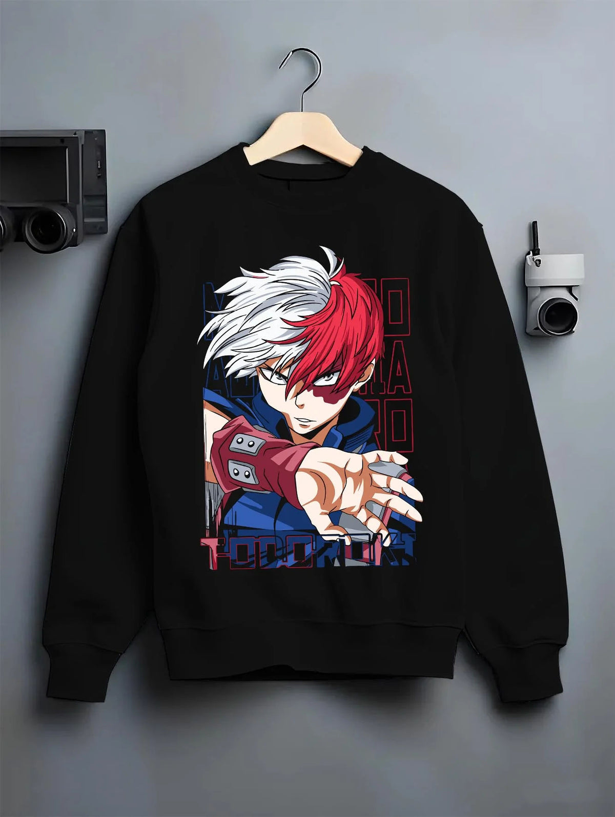 Black crewneck sweatshirt on hanger featuring Shoto Todoroki My Hero Academia fire and ice artwork.