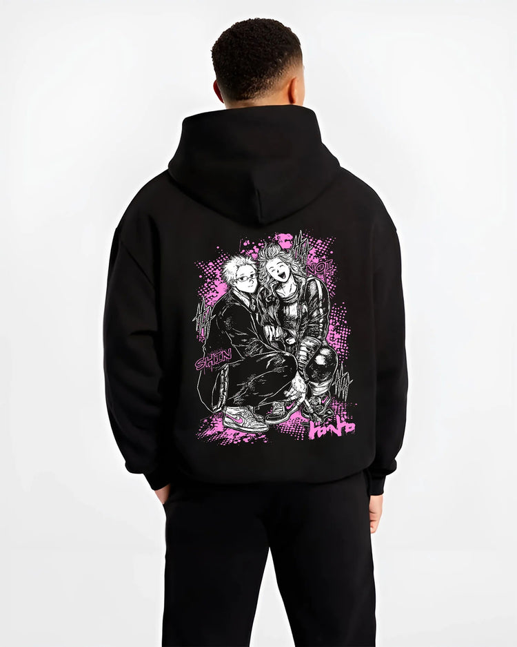 Black hoodie model back view showing Dandadan: Okarun and Momo duo