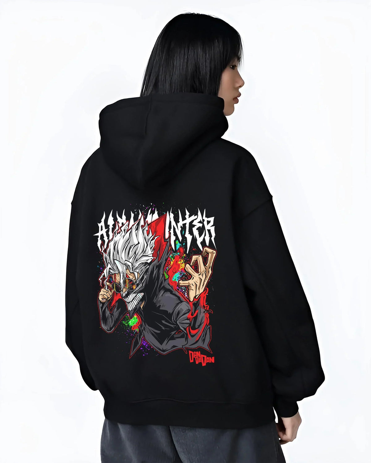 Black hoodie worn by female model, back view with Ken Turbo Form Hoodie Dandadan Supernatural Fight graphic premium wear.