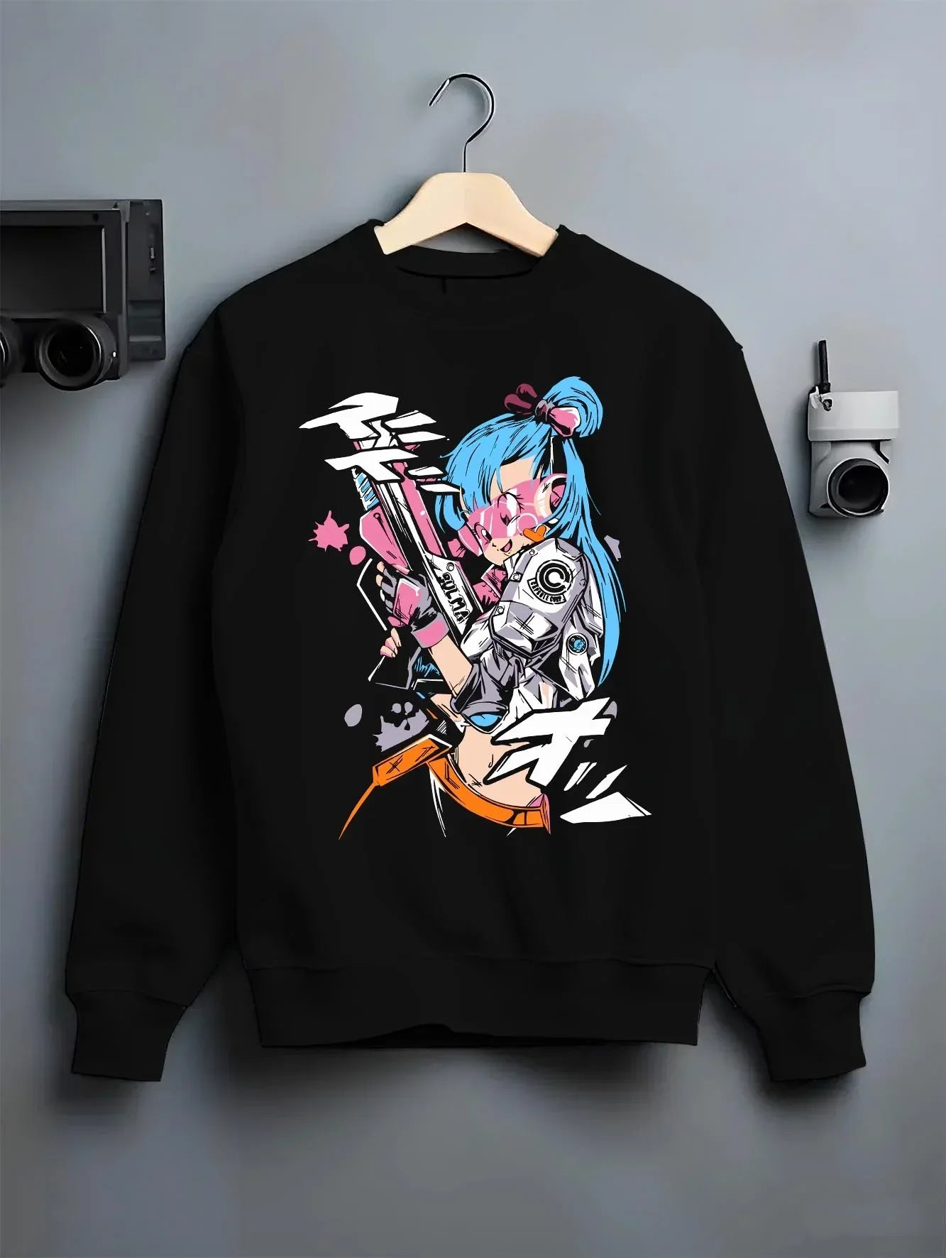 Black crewneck sweatshirt on hanger with Bulma Hoodie Dragon Ball Retro Capsule Corp Scene graphic premium wear.