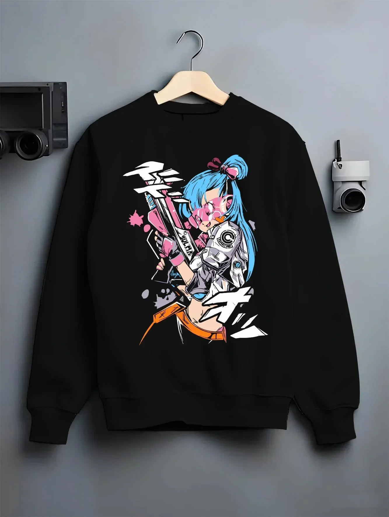 Black crewneck sweatshirt on hanger with Bulma Hoodie Dragon Ball Retro Capsule Corp Scene graphic premium wear.