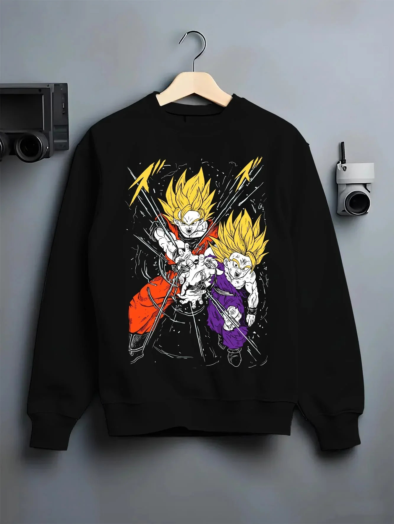 Black crewneck sweatshirt on hanger with Gohan Hoodie Dragon Ball Z Super Saiyan Rage Clash graphic bold anime graphic.
