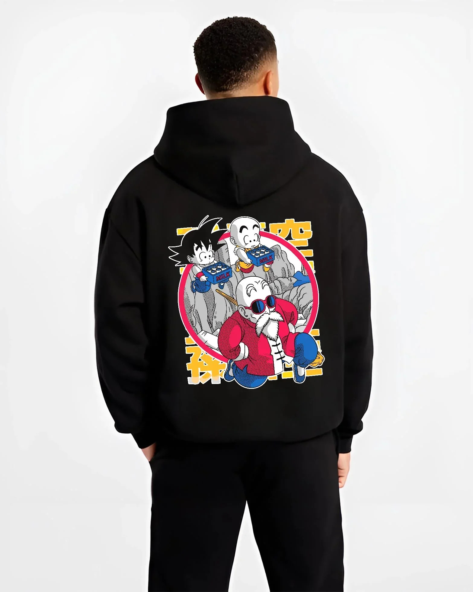 Black hoodie worn by male model, back view with Dragon Ball Hoodie Krillin Retro Training White Gi graphic streetwear graphic.