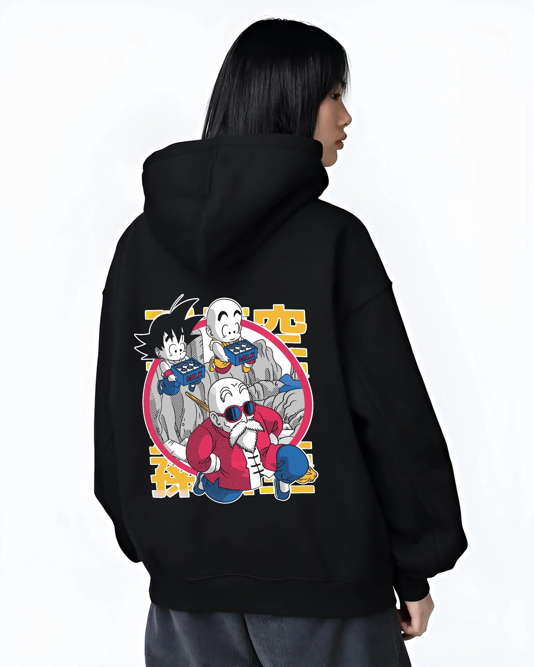 Black hoodie worn by female model, back view with Dragon Ball Hoodie Krillin Retro Training White Gi graphic premium wear.