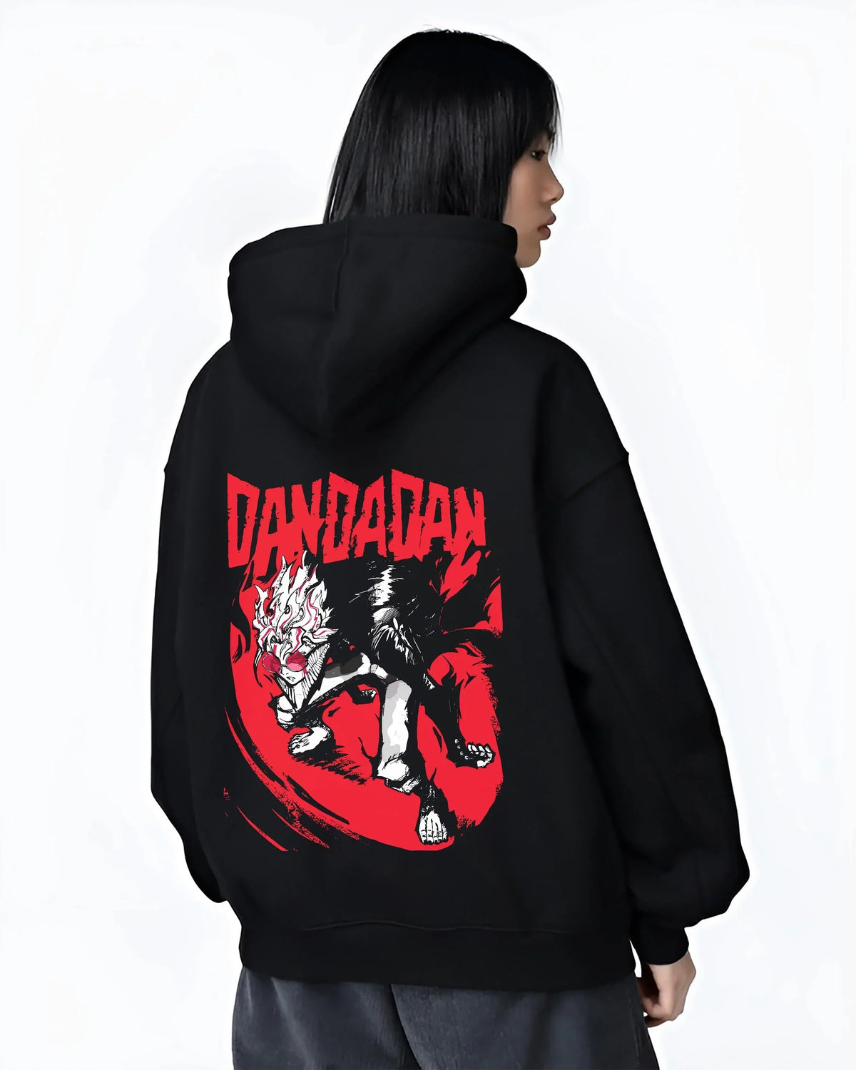 Black hoodie worn by female model, back view with Dandadan Hoodie Retro Anime Occult Spirit Adventure graphic nan themed artwork.