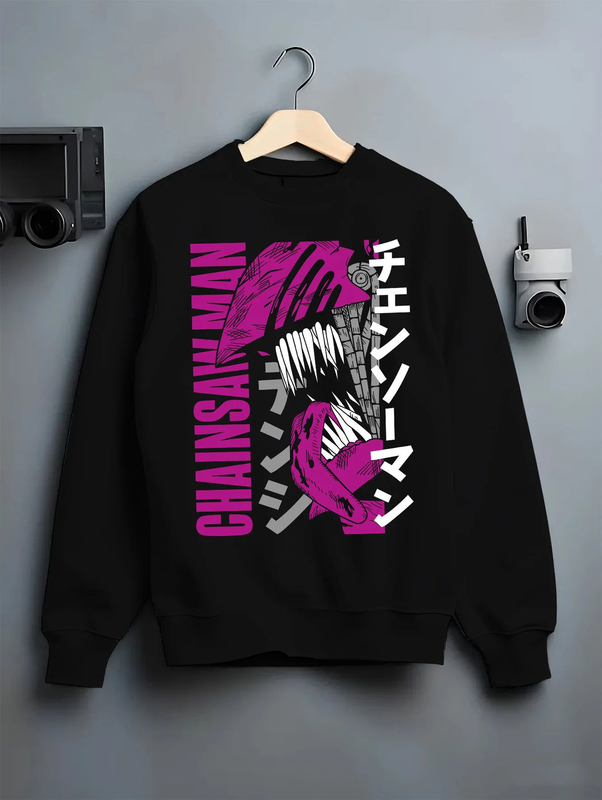 Black crewneck sweatshirt on hanger showing Chainsaw Devil / Denji from Chainsaw Man: purple stylised manga poster