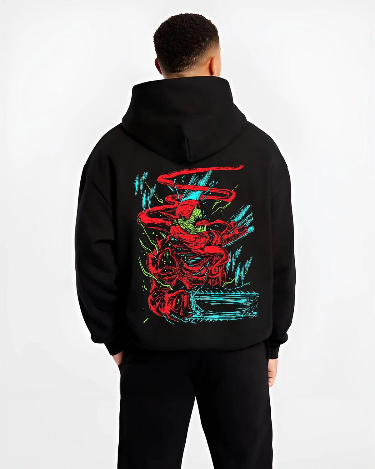 Black hoodie model back view showing Chainsaw Devil from Chainsaw Man: red/green abstract fighting pose