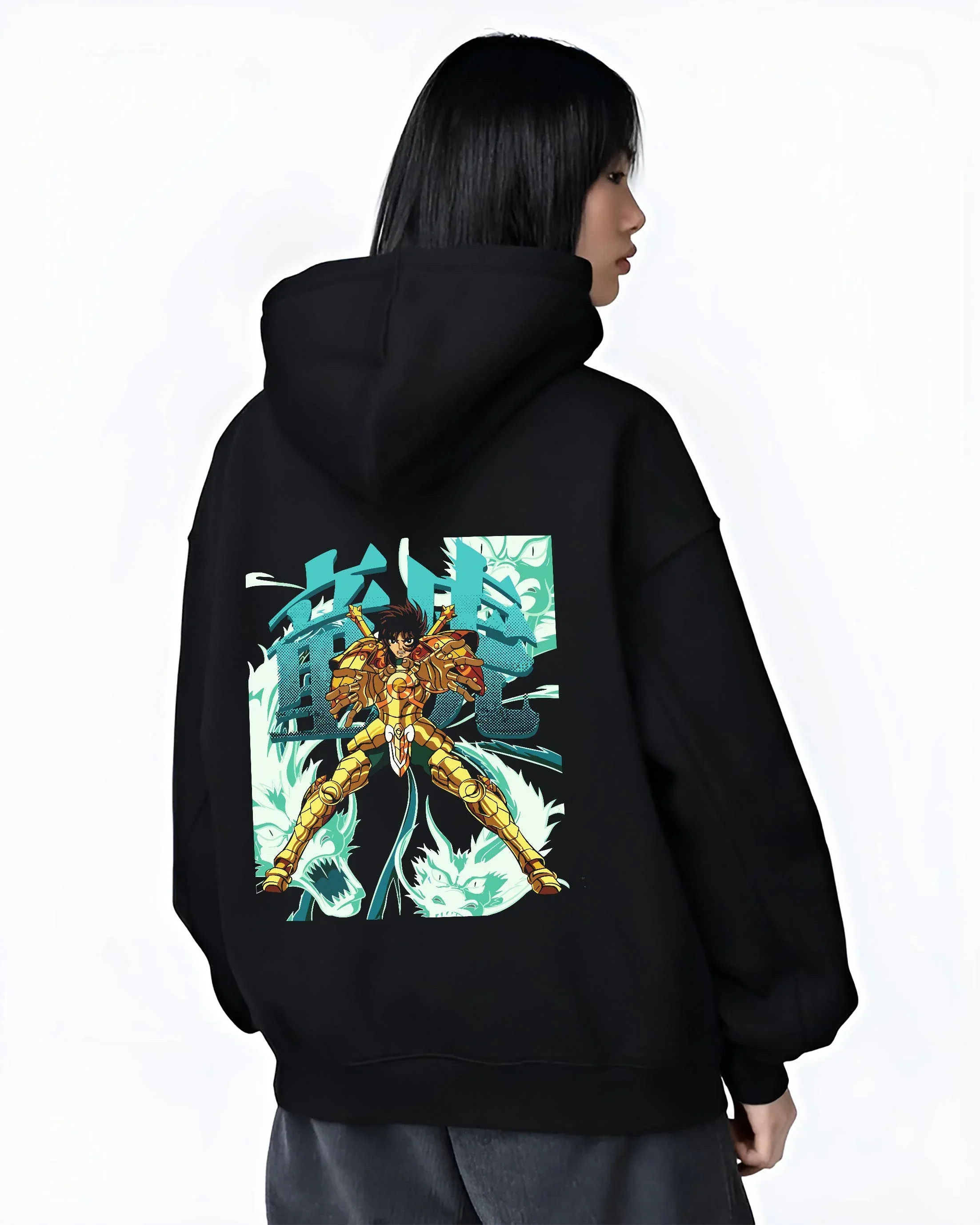 Black hoodie worn by female model, back view with Shiryu Hoodie Saint Seiya Dragon Gold Cloth Retro graphic streetwear graphic.