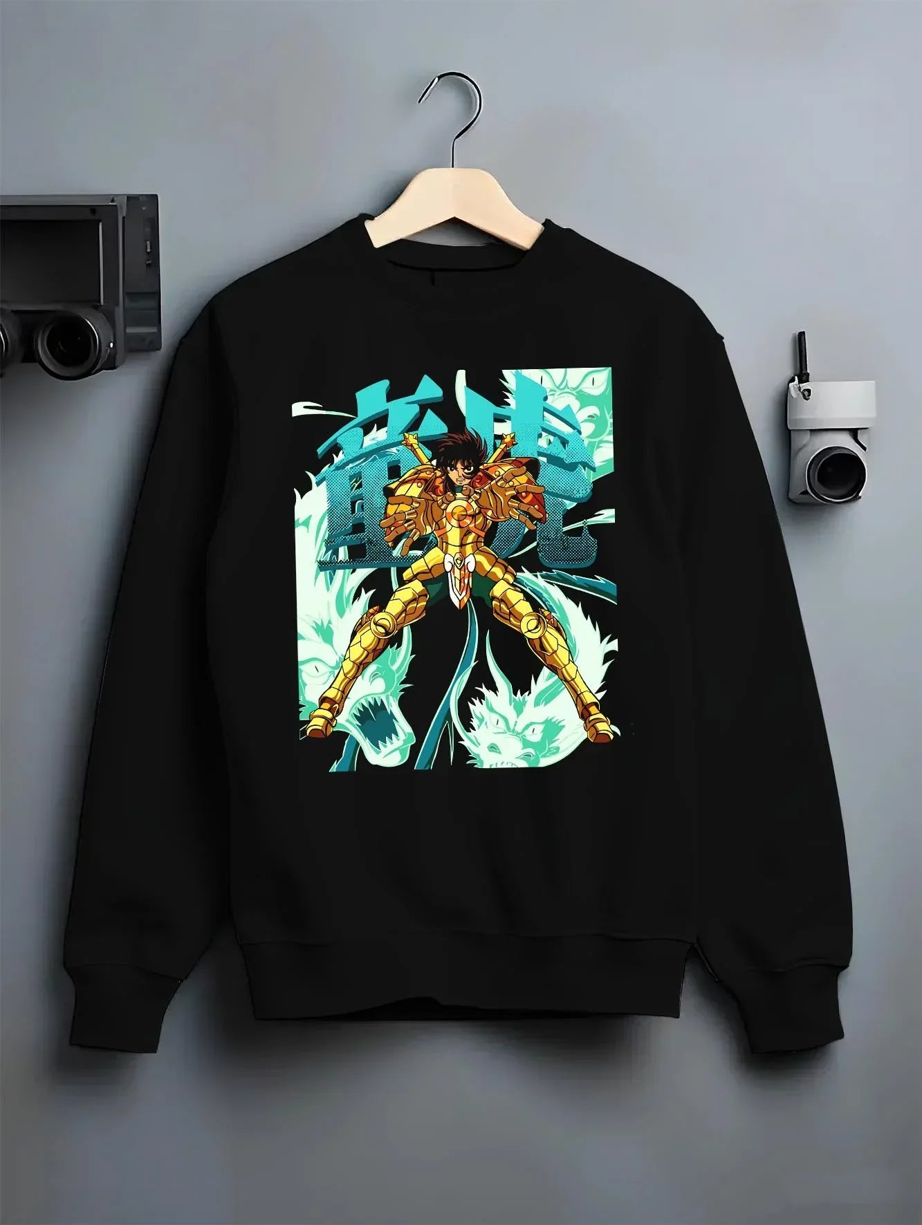 Black crewneck sweatshirt on hanger with Shiryu Hoodie Saint Seiya Dragon Gold Cloth Retro graphic streetwear graphic.