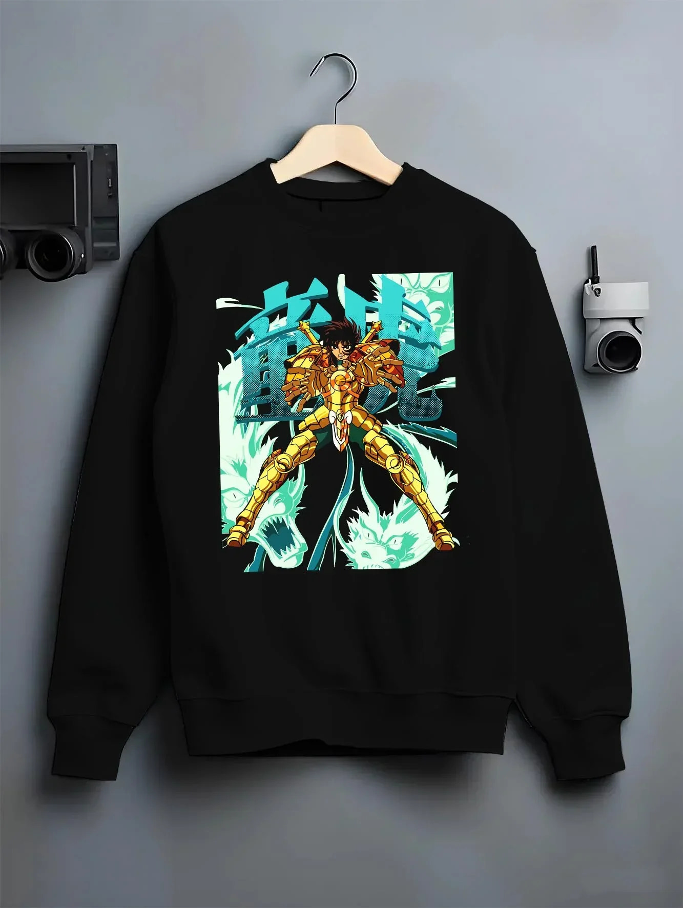 Black crewneck sweatshirt on hanger with Shiryu Hoodie Saint Seiya Dragon Gold Cloth Retro graphic streetwear graphic.