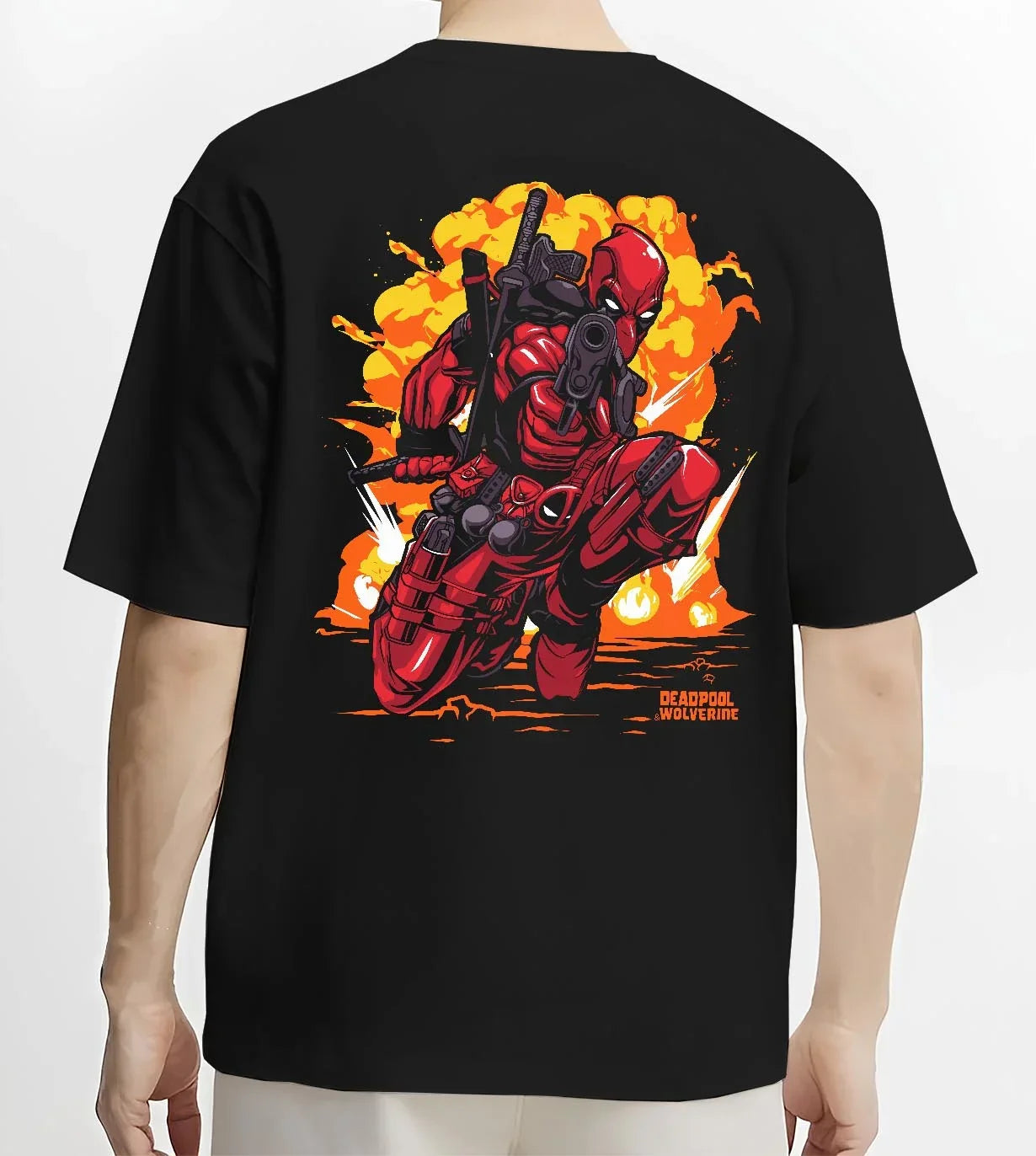 Black T-shirt worn by male model, back view with Deadpool Hoodie Marvel Anime Cross Retro Parody Art graphic bold anime graphic.