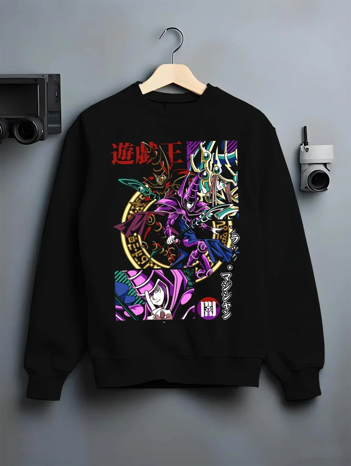 Black crewneck sweatshirt on hanger with Yu-Gi-Oh Dark Magician Hoodie Duel Monsters Jumper graphic bold anime graphic.