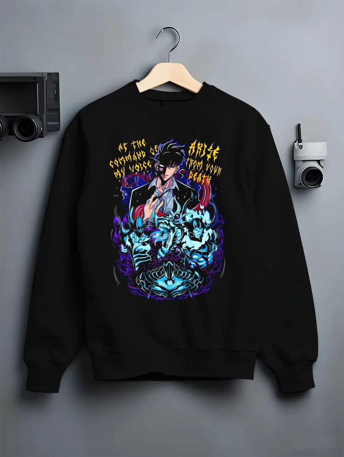 Black crewneck sweatshirt on hanger featuring dark beast battle artwork.