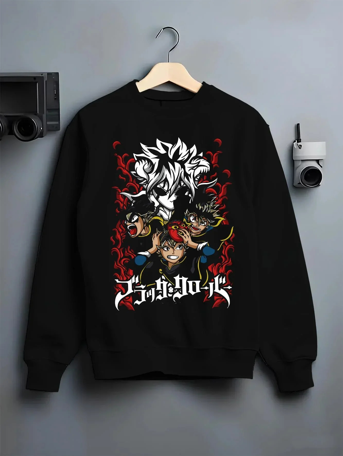 Black crewneck sweatshirt on hanger with Asta Hoodie Black Clover Trio Retro Anime Poster graphic streetwear graphic.