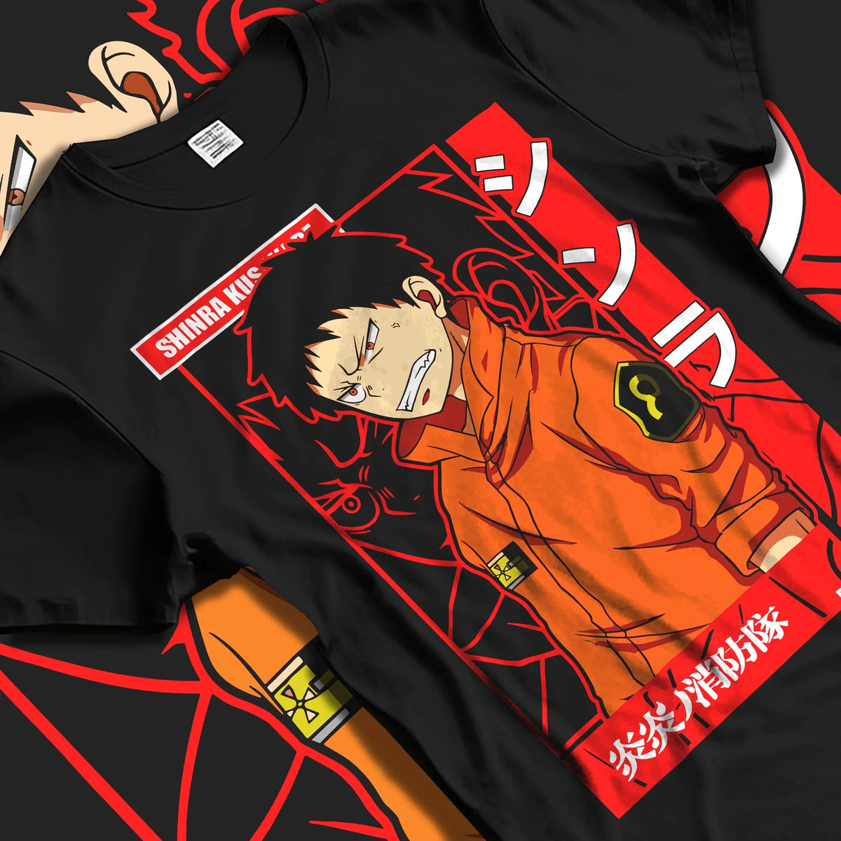 Black T-shirt laid flat with natural folds featuring Shinra Kusakabe Fire Force hero artwork.