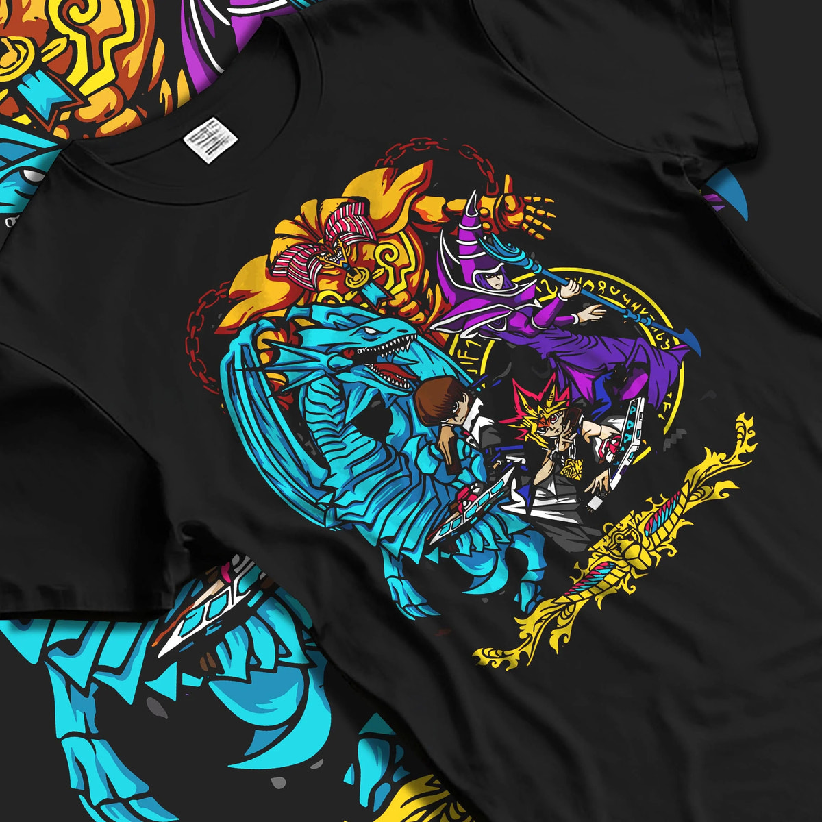 Black T-shirt laid flat with natural folds featuring Yu-Gi-Oh Egyptian Gods trio artwork.