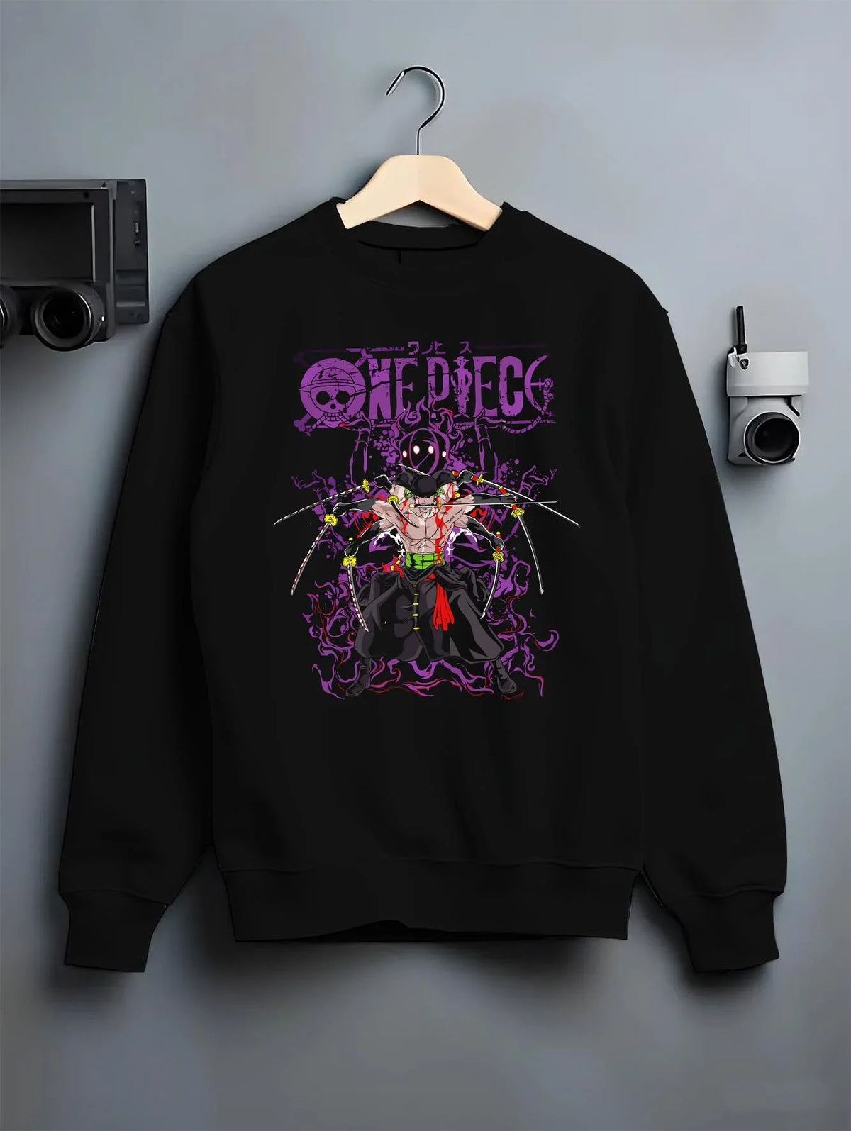 Black crewneck sweatshirt on hanger featuring Roronoa Zoro One Piece Enma King of Hell artwork.