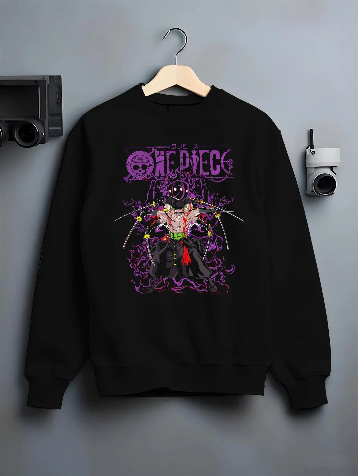 Black crewneck sweatshirt on hanger featuring Roronoa Zoro One Piece Enma King of Hell artwork.