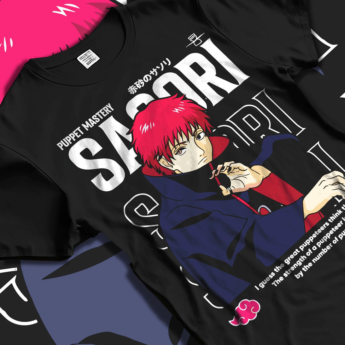 Black T-shirt laid flat with natural folds featuring Sasori Naruto puppet master Akatsuki artwork.