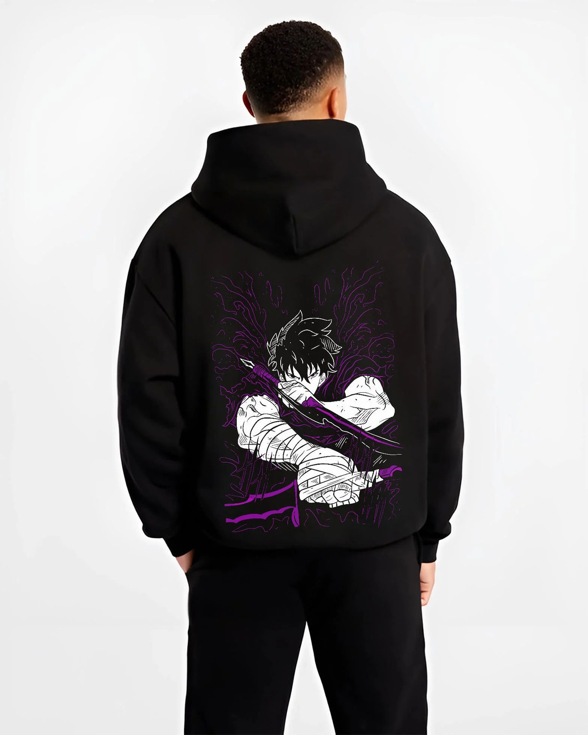 Black hoodie worn by male model from the back featuring Ken Kaneki Tokyo Ghoul dark awakening artwork.