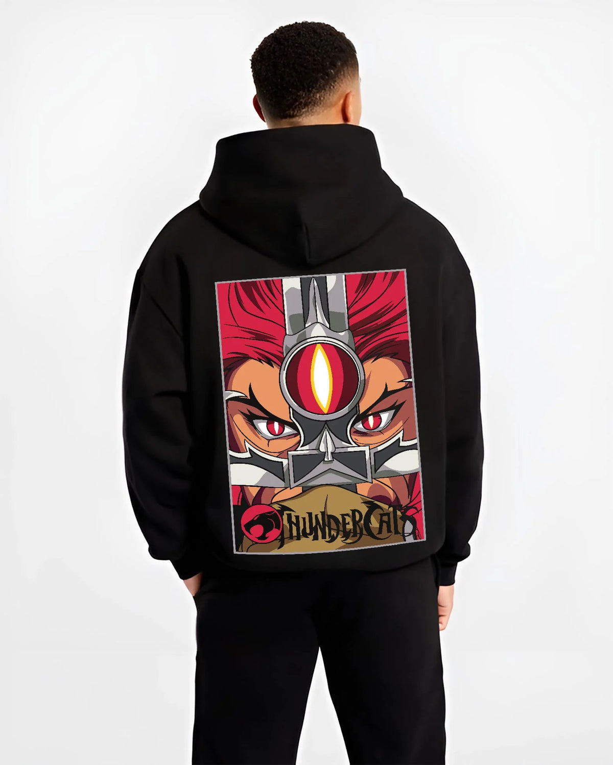 Black hoodie worn by male model from the back featuring Thundercats Eye of Thundera artwork.
