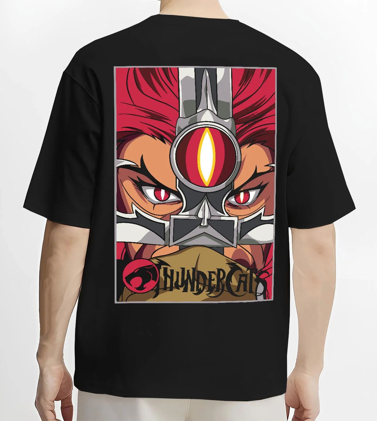 Black T-shirt worn by male model from the back featuring Thundercats Eye of Thundera artwork.