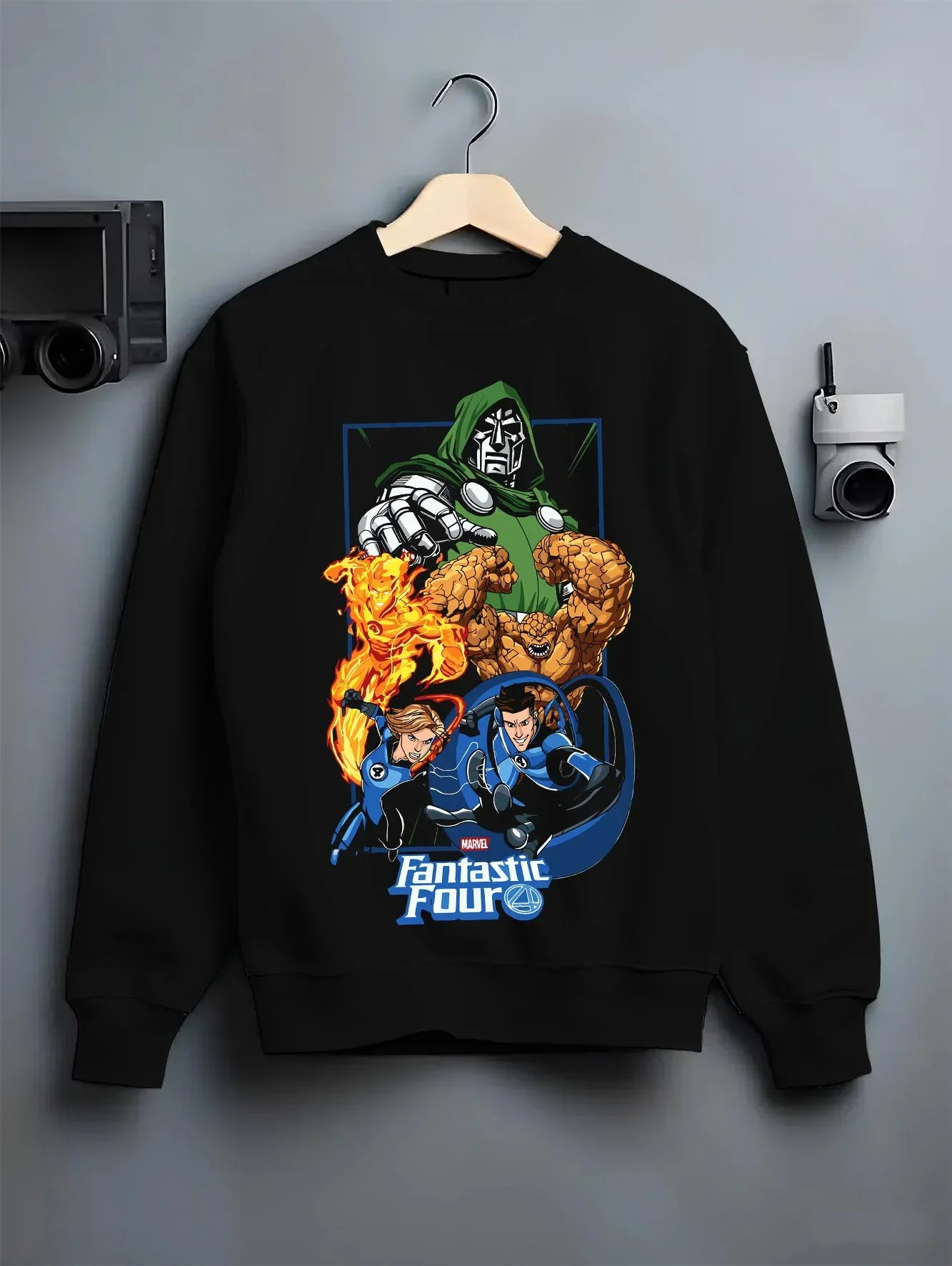 Black crewneck sweatshirt on hanger with Doctor Doom Hoodie Fantastic Four Retro Villain Art graphic streetwear graphic.