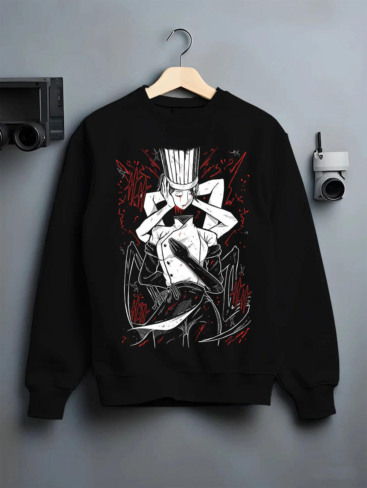 Black crewneck sweatshirt on hanger with Falling Devil in chef attire from Chainsaw Man illustrated back graphic