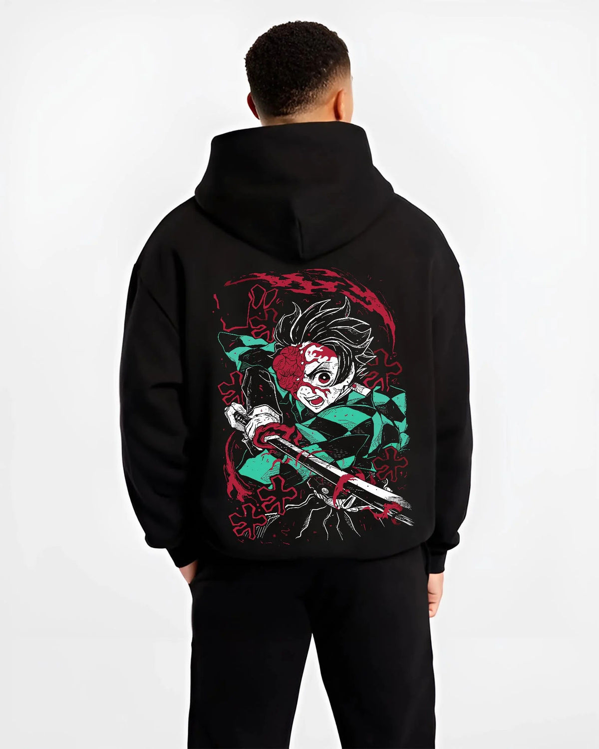 Black hoodie worn by male model from the back featuring Tanjiro Kamado Demon Slayer Fire God Dance artwork.