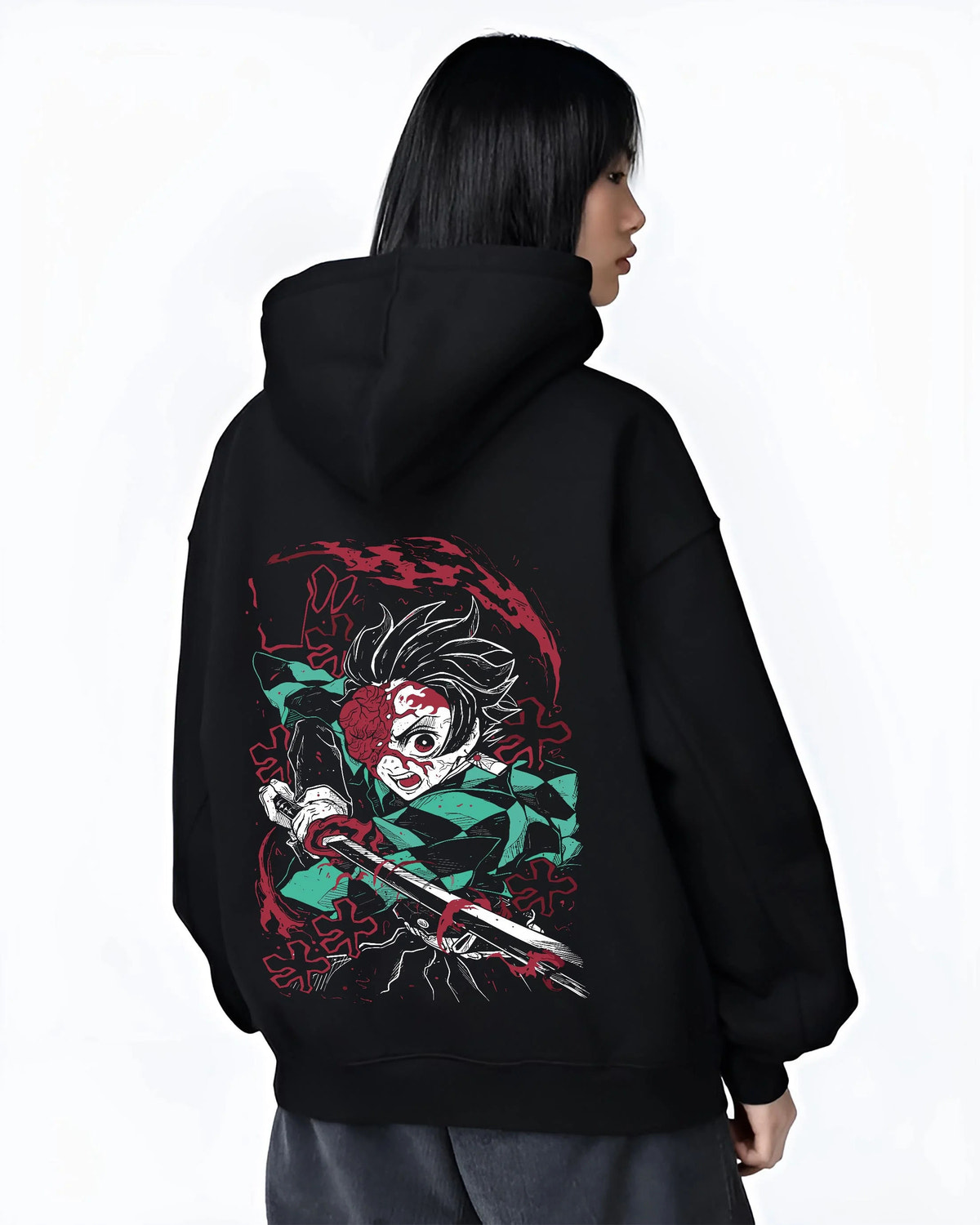 Black hoodie worn by female model from the back featuring Tanjiro Kamado Demon Slayer Fire God Dance artwork.