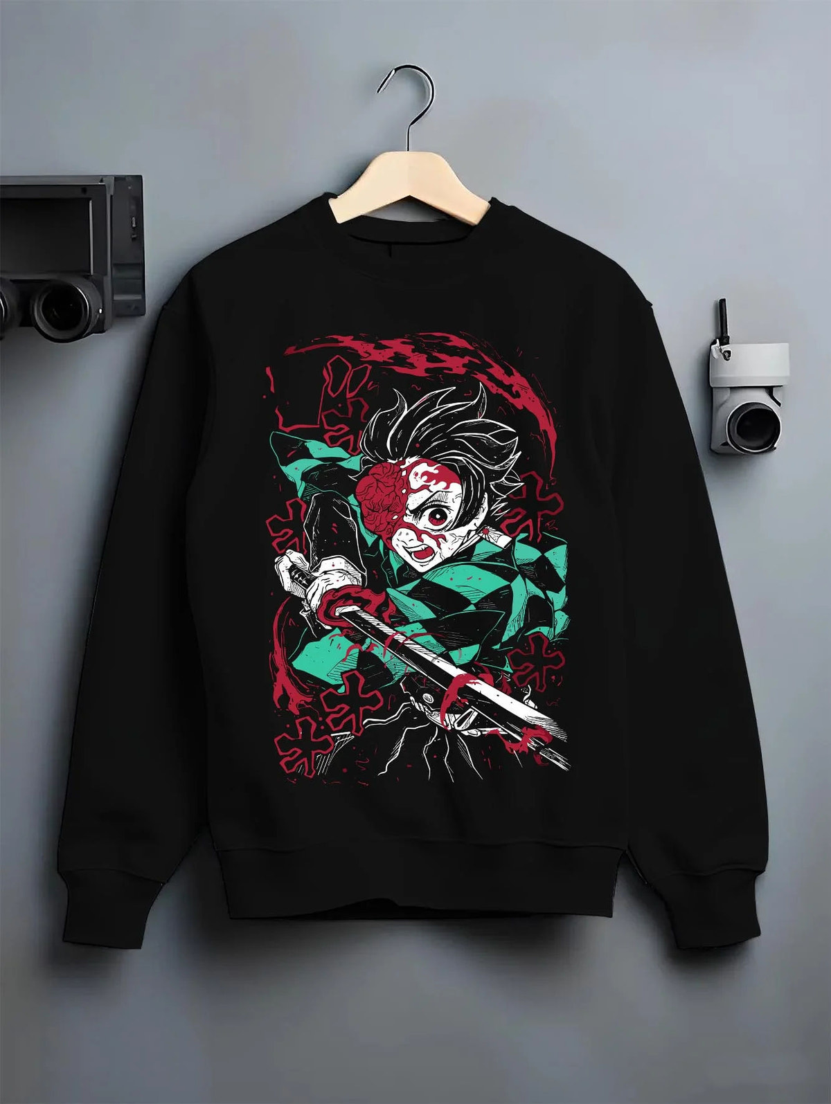 Black crewneck sweatshirt on hanger featuring Tanjiro Kamado Demon Slayer Fire God Dance artwork.