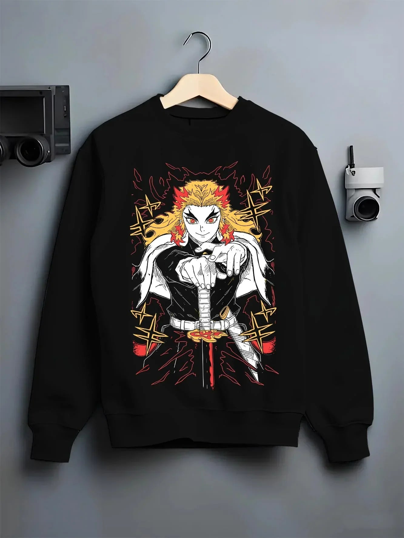 Black crewneck sweatshirt on hanger with Demon Slayer Rengoku Hoodie Flame Pillar Jumper graphic premium wear.