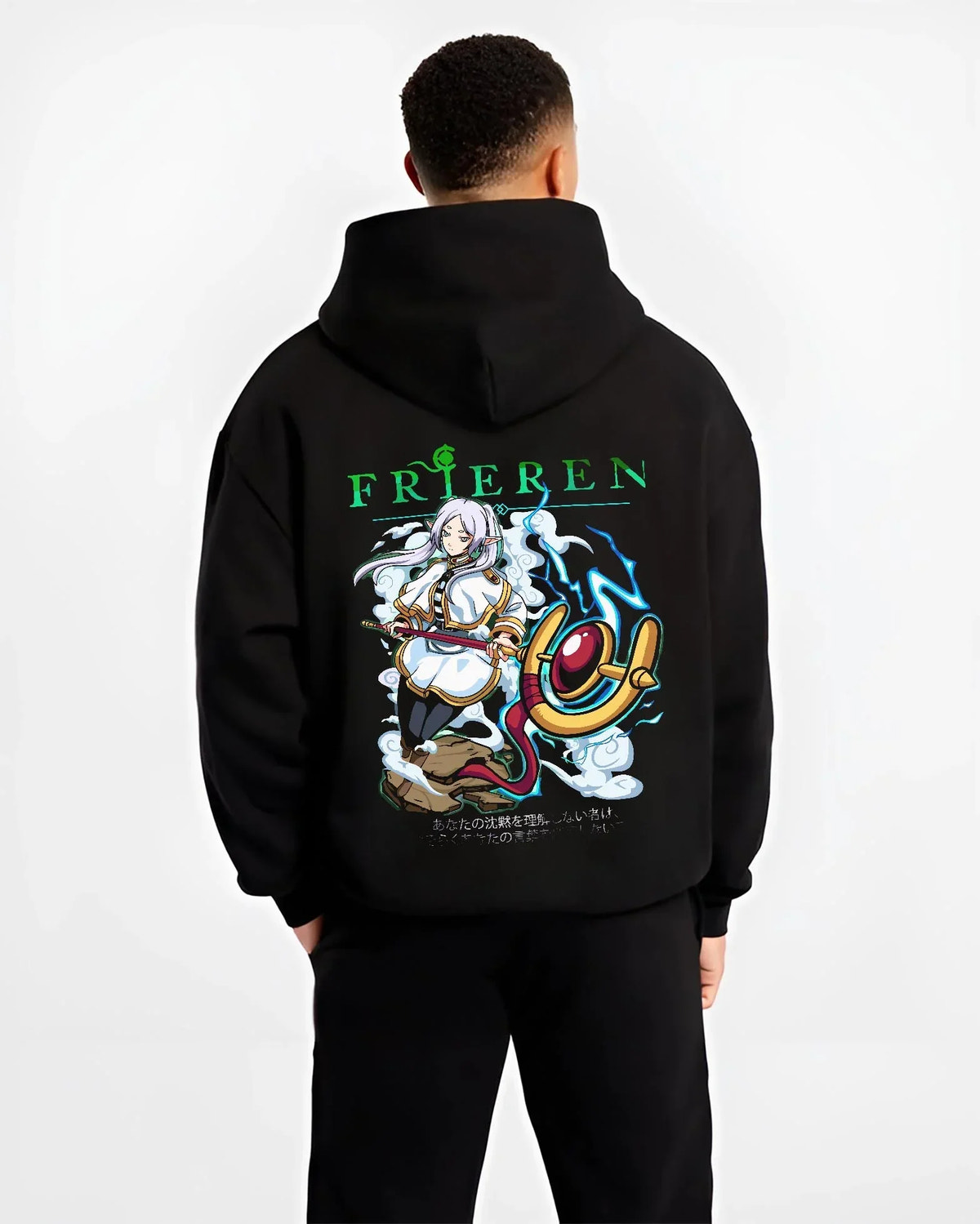 Black hoodie worn by male model, back view with Frieren Hoodie Beyond Journey’s End Magic Pose graphic streetwear graphic.