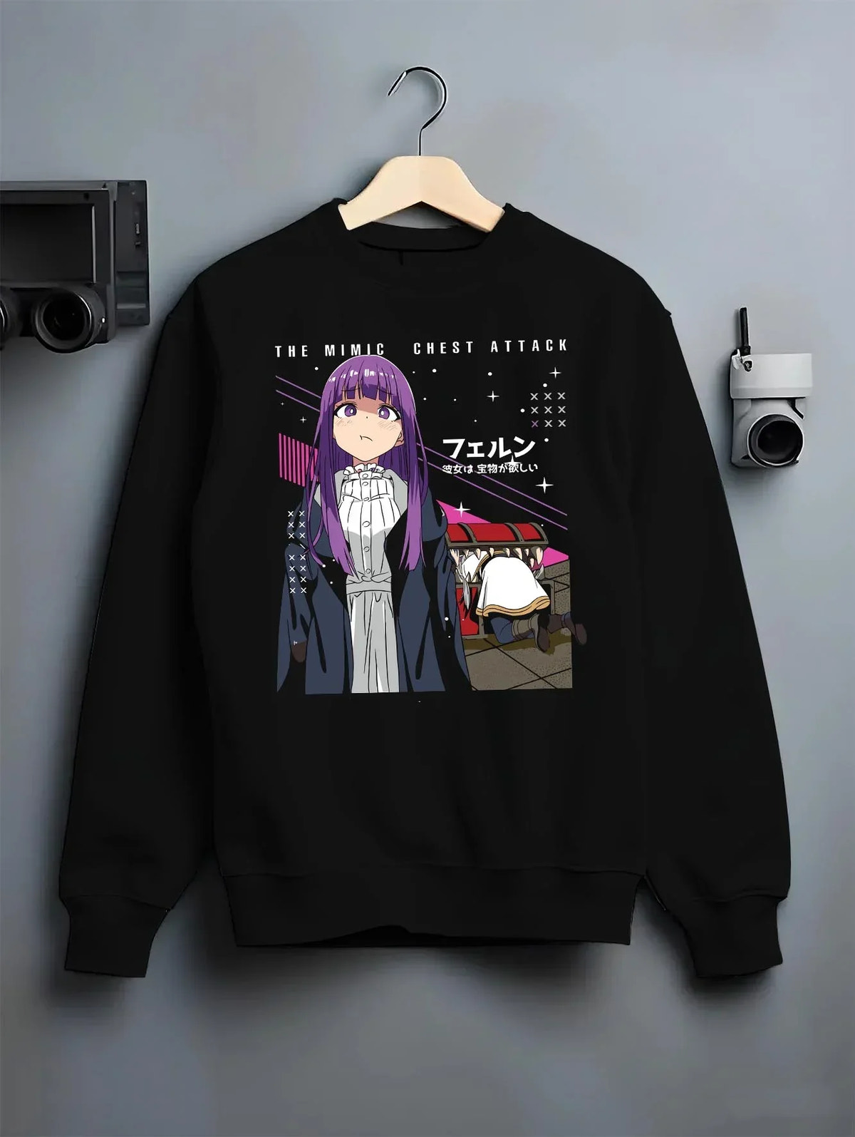 Black crewneck sweatshirt on hanger with Frieren Hoodie Beyond Journey’s End White Dress graphic bold anime graphic.