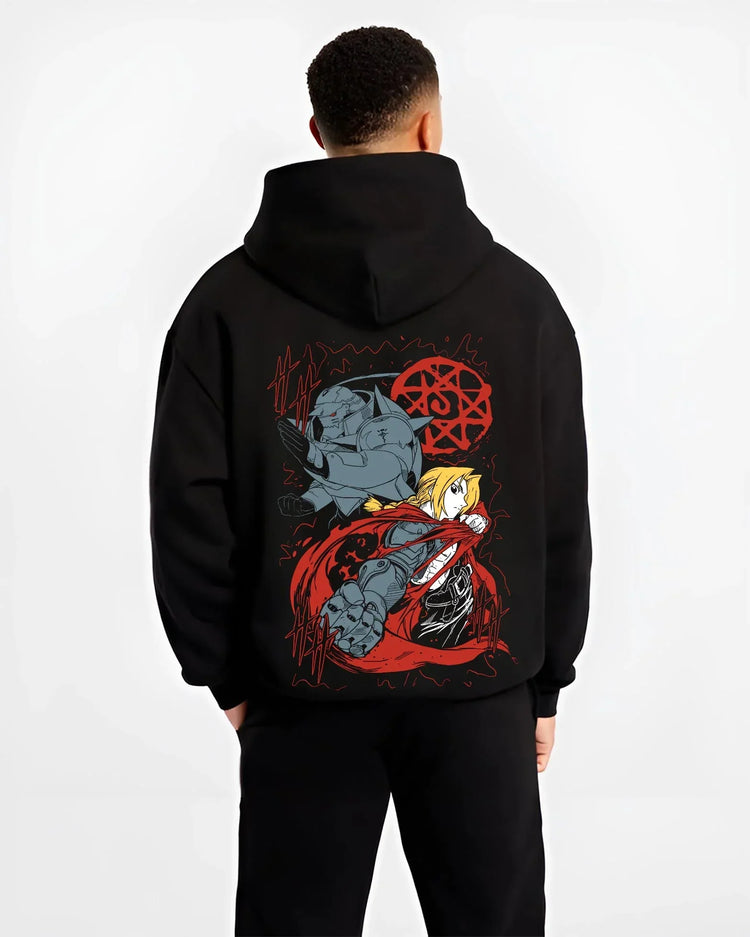 Black hoodie worn by male model, back view with Edward Elric Hoodie Fullmetal Alchemist Red Energy graphic bold anime graphic.