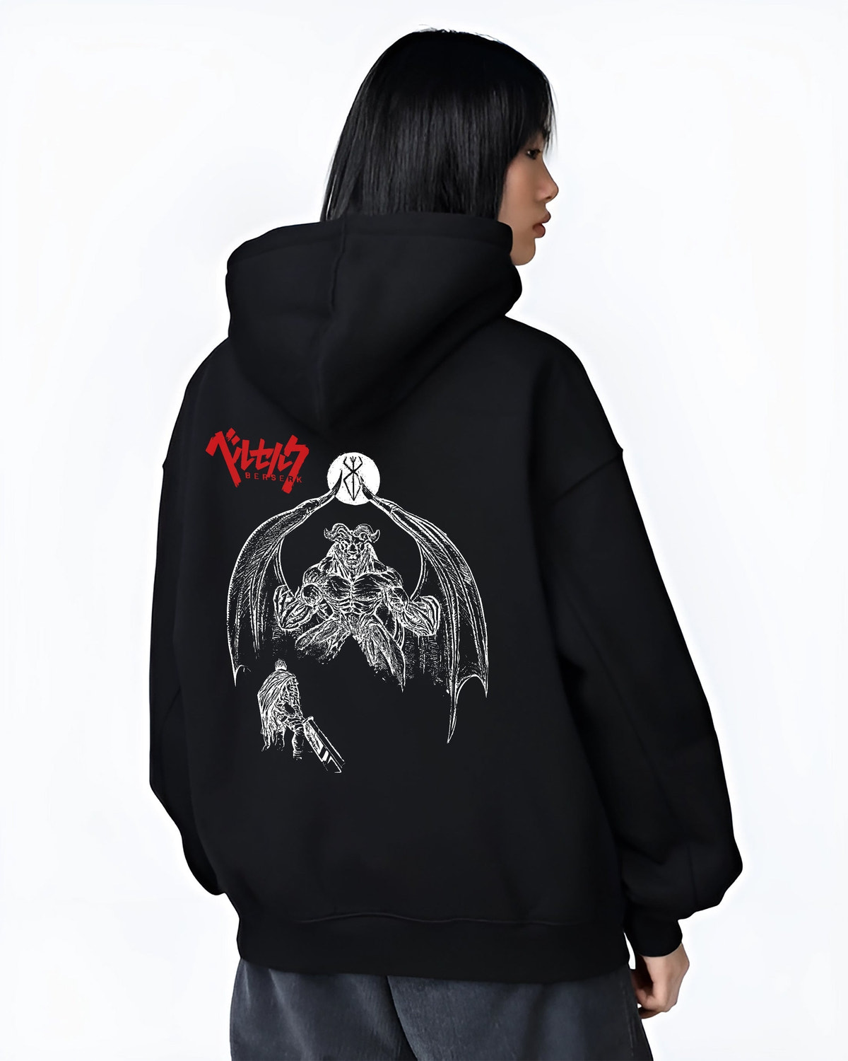 Black hoodie worn by a female model, back view, featuring Berserk Guts anime poster inspired artwork with demonic apostle under moon and gritty manga style.