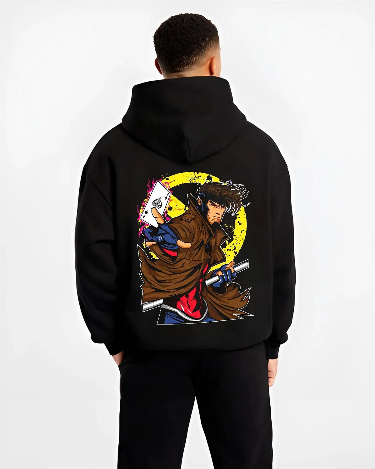 Black hoodie worn by male model, back view with Yu Gi Oh Hoodie Gambit Yami Yugi Duelist Jumper graphic premium wear.