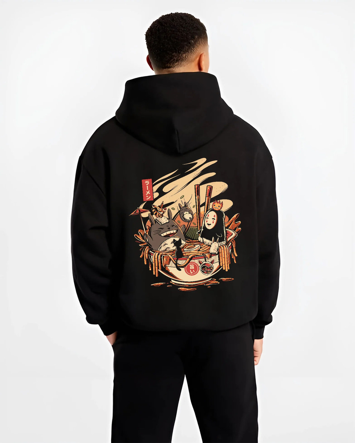 Black hoodie model back view showing Totoro, No-Face, Calcifer from Studio Ghibli: ramen crossover