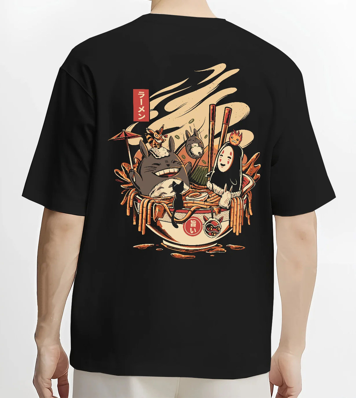 Black T-shirt model back view showing Totoro, No-Face, Calcifer from Studio Ghibli: ramen crossover