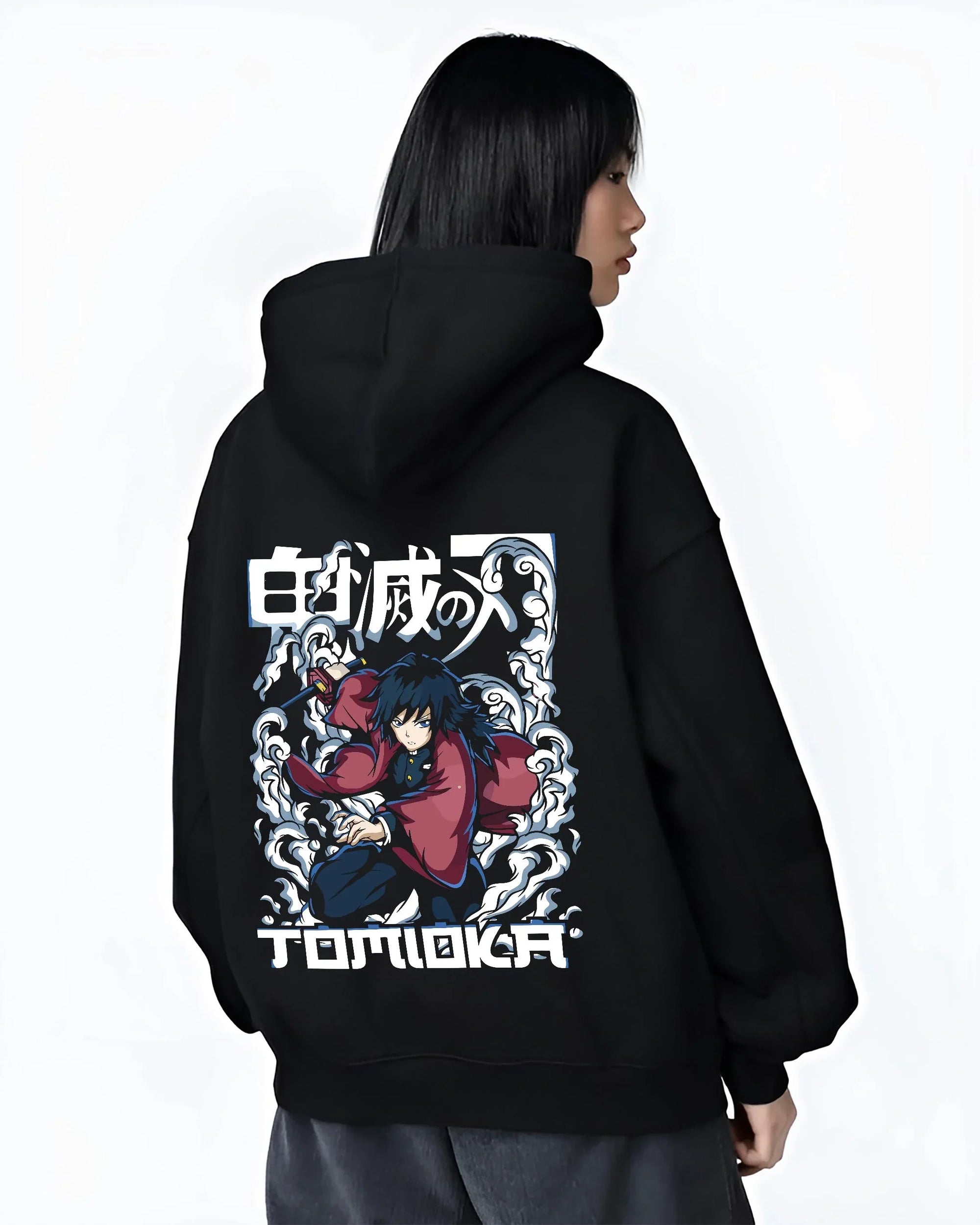 Black hoodie worn by female model, back view with Demon Slayer Hoodie Giyu Tomioka Dynamic Pose Jumper graphic streetwear graphic.