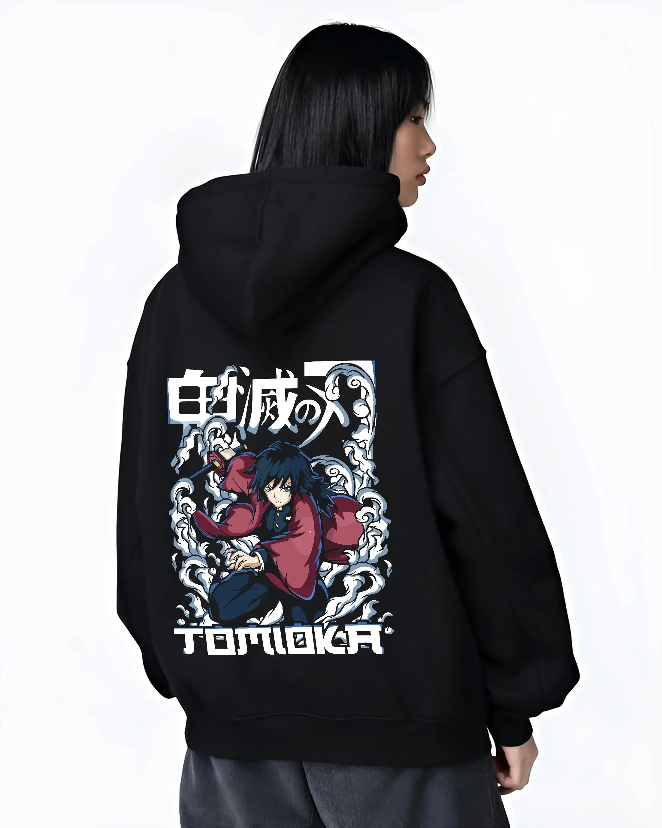 Black hoodie worn by female model, back view with Demon Slayer Hoodie Giyu Tomioka Dynamic Pose Jumper graphic streetwear graphic.