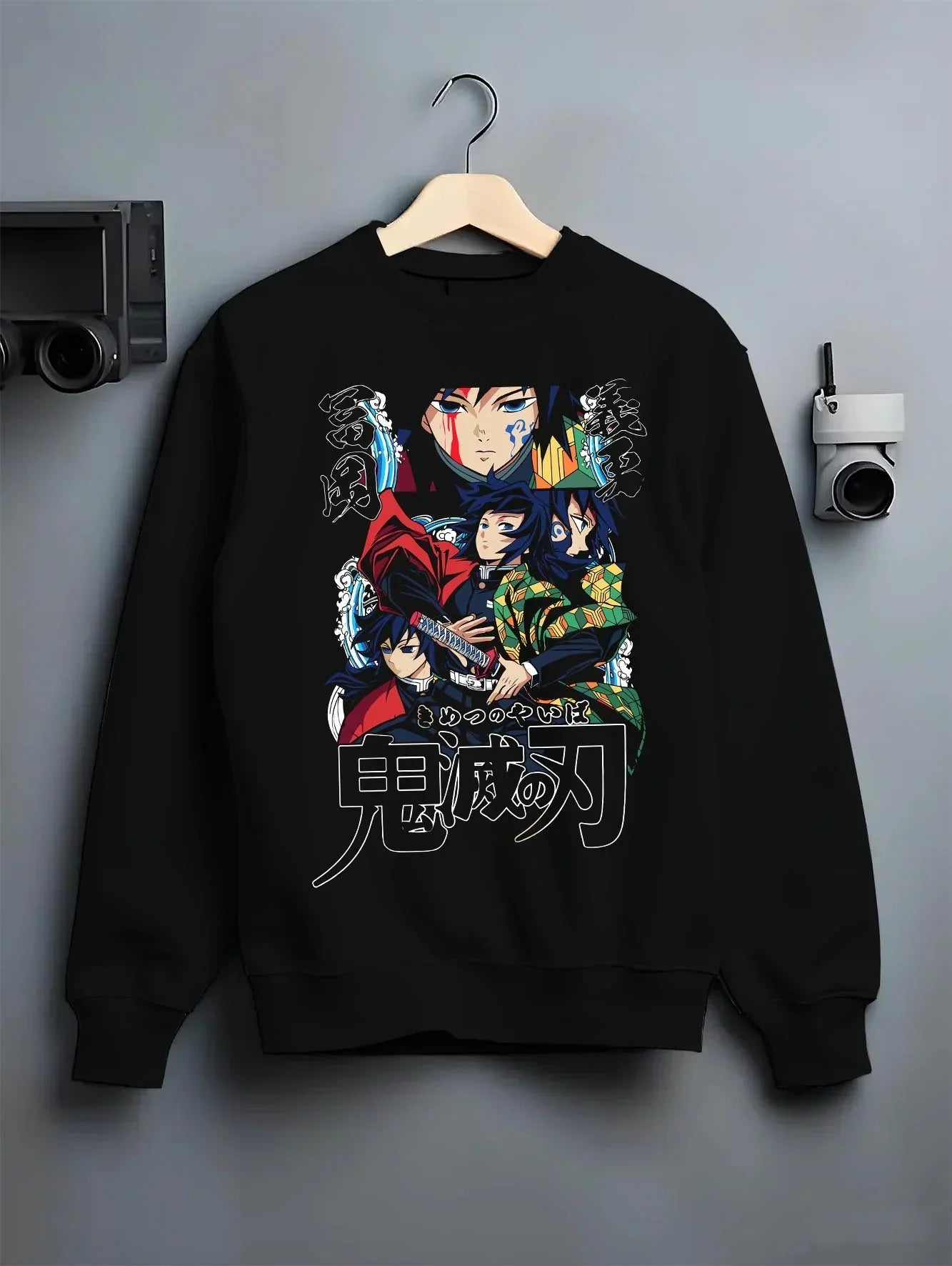 Black crewneck sweatshirt on hanger with Demon Slayer Hoodie Giyu Tomioka Water Pillar Jumper graphic bold anime graphic.