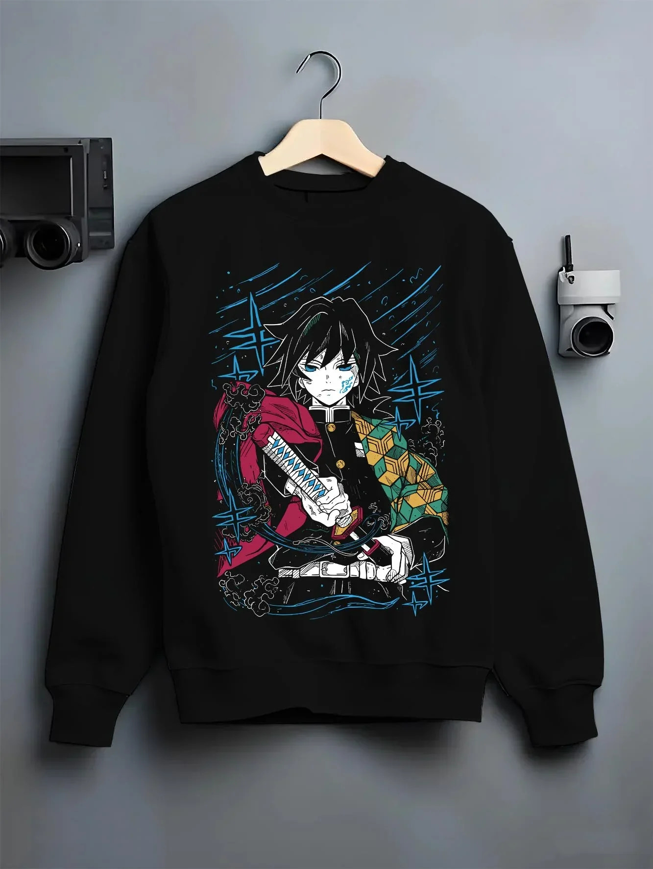 Black crewneck sweatshirt on hanger with Demon Slayer Hoodie Giyu Tomioka Upgraded Power Jumper graphic premium wear.