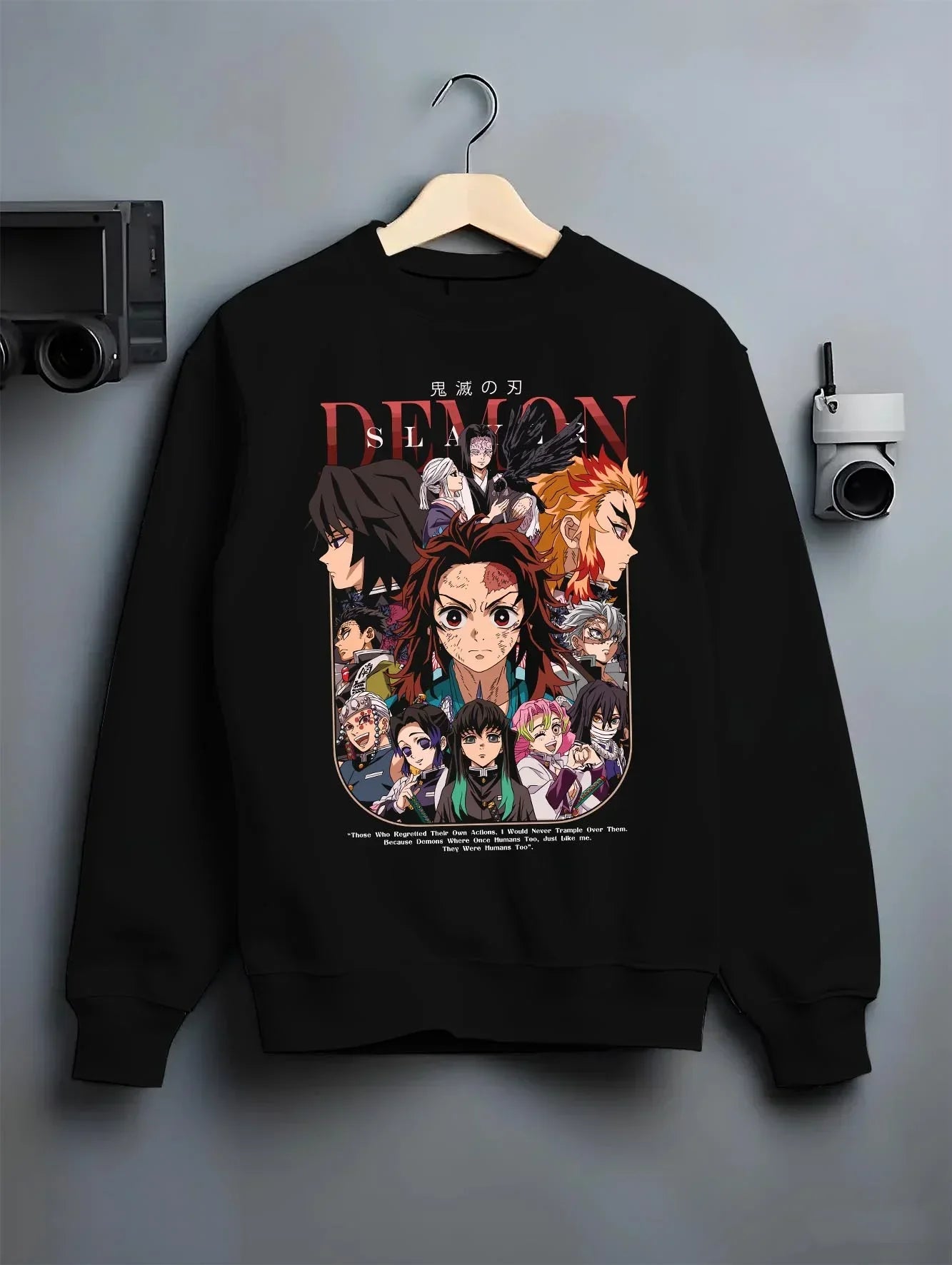 Black crewneck sweatshirt on hanger with Demon Slayer Hoodie Corps United Hashira Fighters graphic premium wear.
