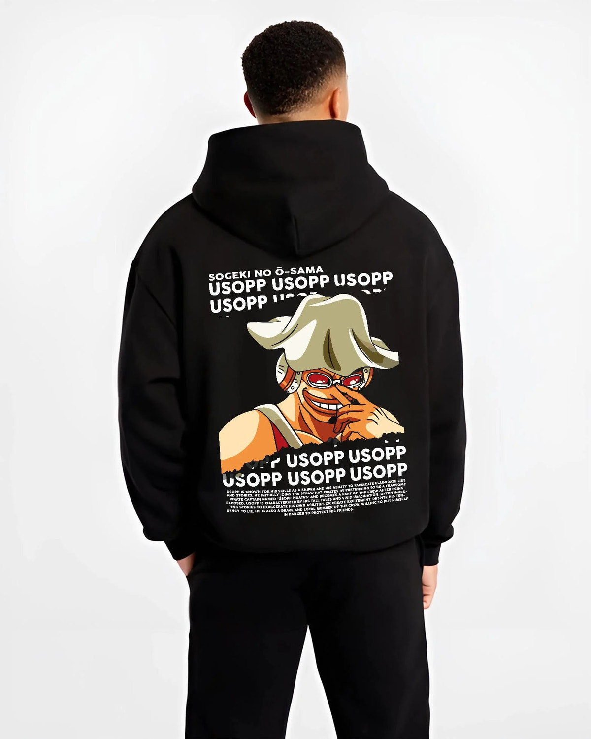 Black hoodie worn by male model from the back featuring God Usopp One Piece meme sniper artwork.