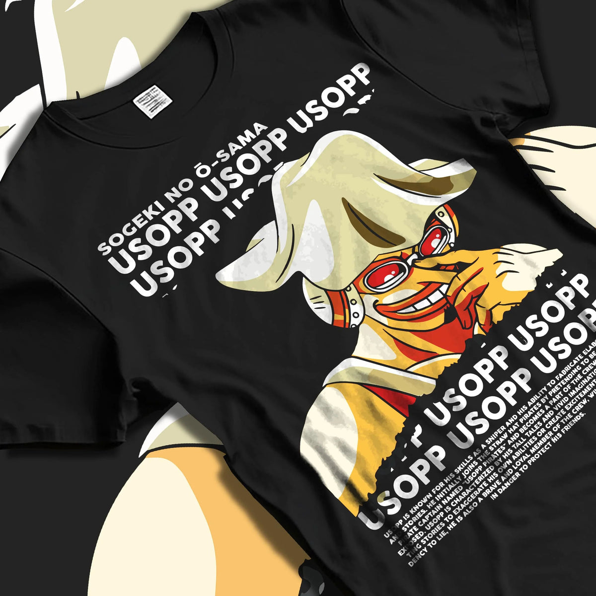 Black T-shirt laid flat with natural folds featuring God Usopp One Piece meme sniper artwork.