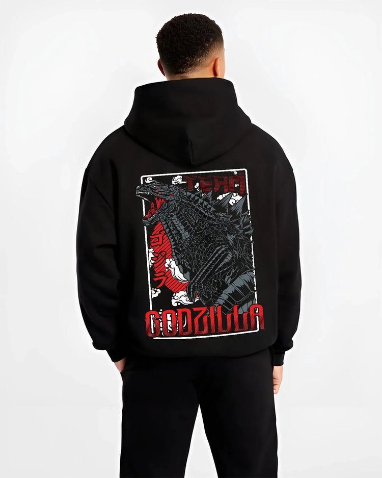 Black hoodie worn by male model, back view with Godzilla Hoodie King of Monsters Anime Jumper graphic premium wear.