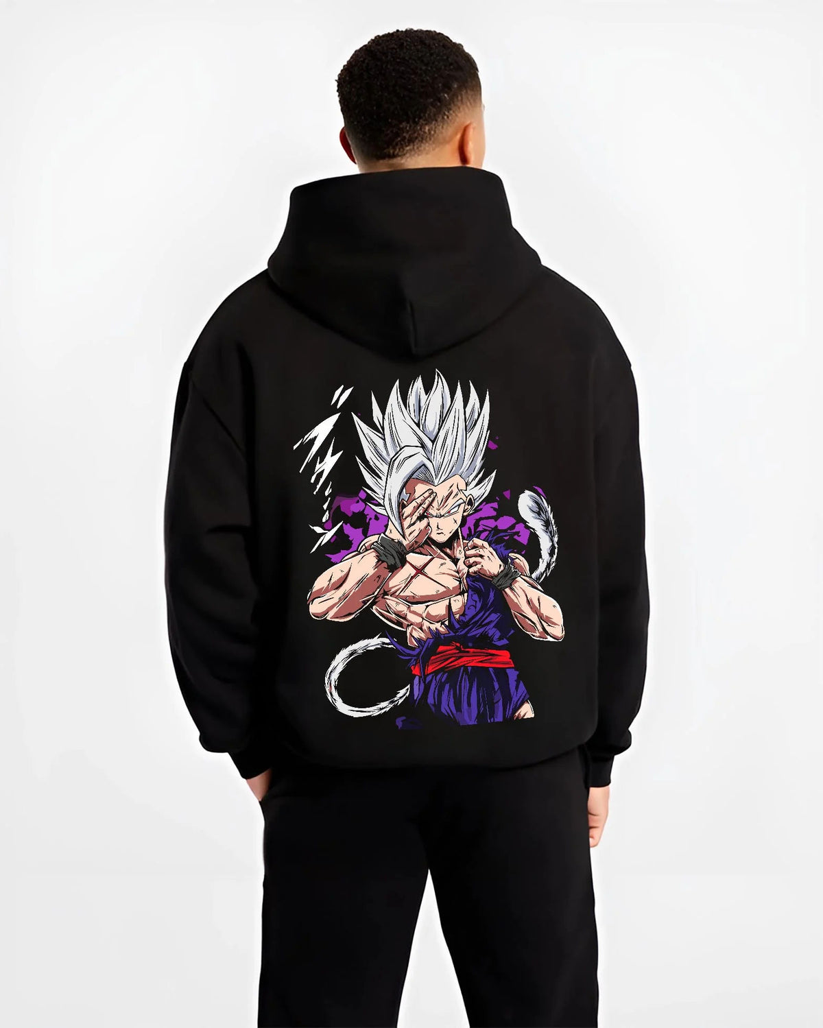 Black hoodie worn by male model from the back featuring Gohan Dragon Ball energy wave battle artwork.