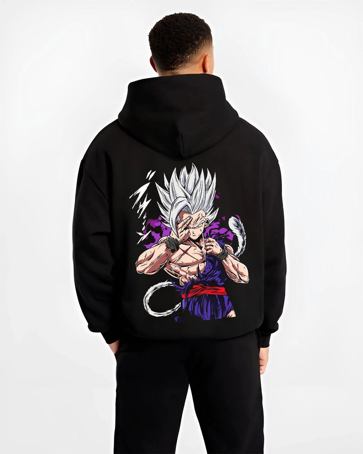 Black hoodie worn by male model from the back featuring Gohan Dragon Ball energy wave battle artwork.