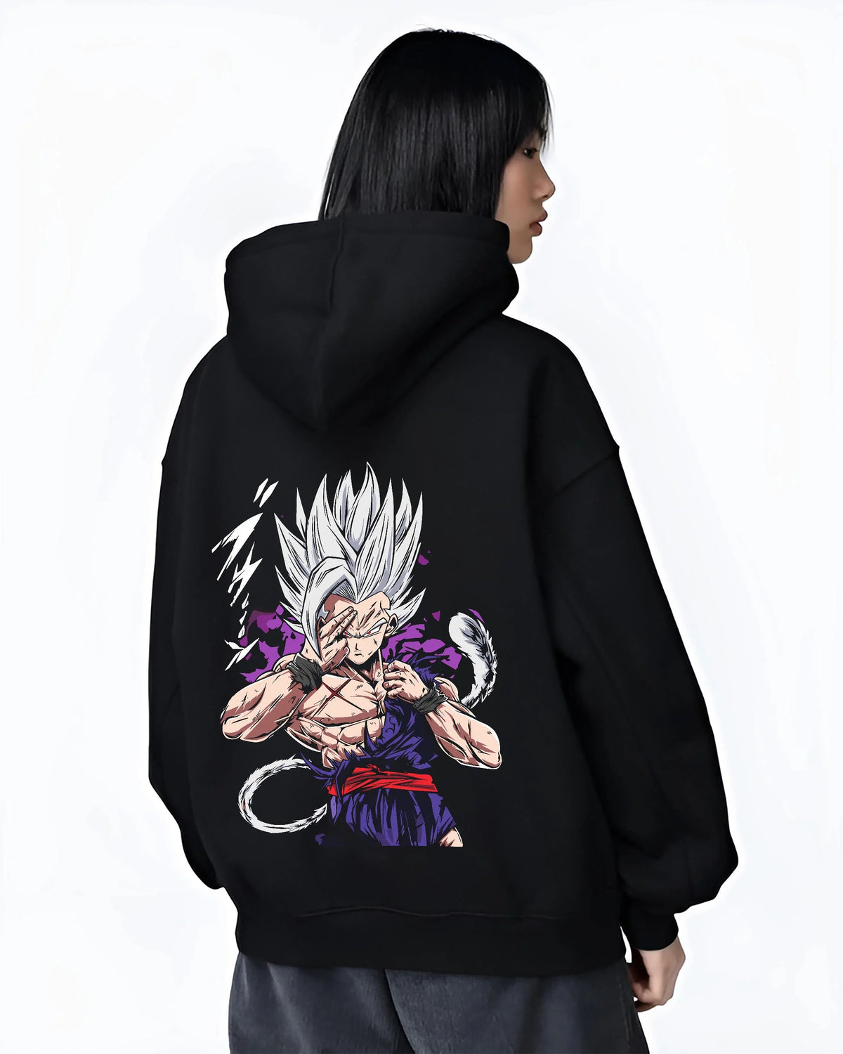 Black hoodie worn by female model from the back featuring Gohan Dragon Ball energy wave battle artwork.